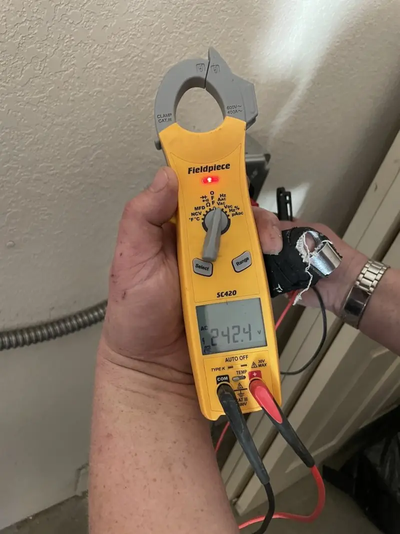Voltage testing with clamp meter during Ceiling Fan Installation in Beebe